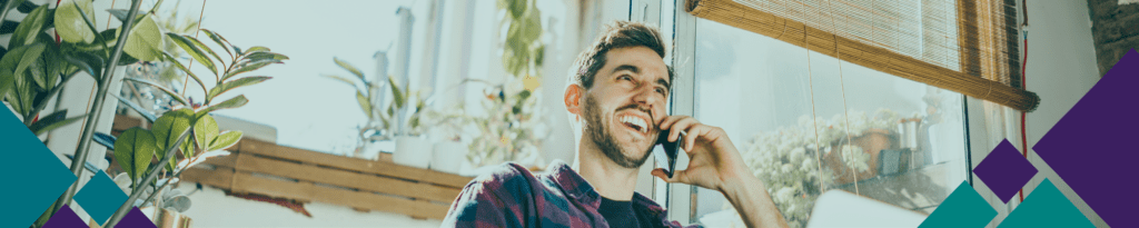 Young man smiling while talking on the phone